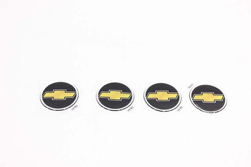 EMBLEMA CALOTA TRACKER 01/09 PRETO/DOURADO 55MM